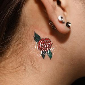 coin size rose tattoo