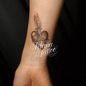 メダイのタトゥー