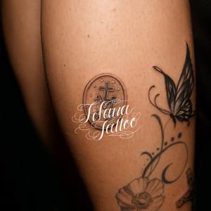 メダイのタトゥー